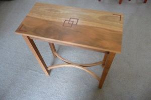 C H SpottedgumHalltablewithRedguminlayandhiddendrawer.25